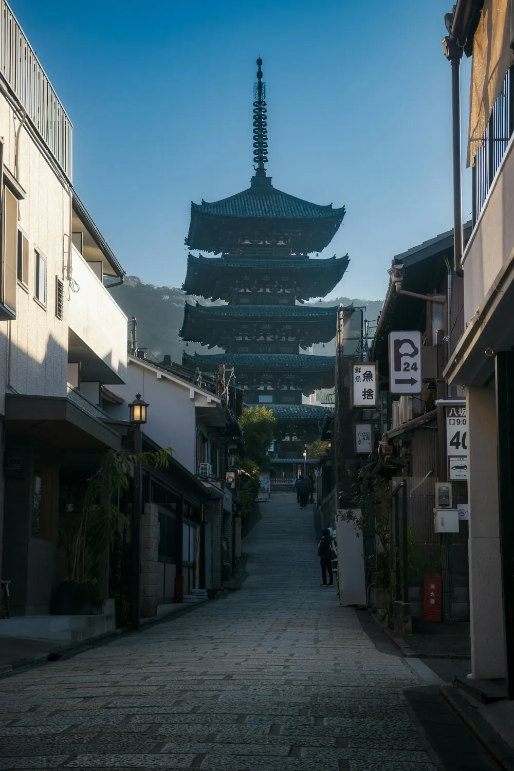 A narrow Kyoto street and Yasaka Pagoda in clear morning light